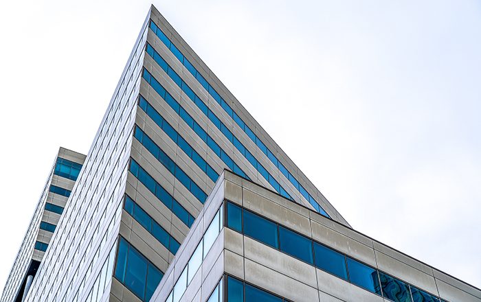 A modern skyscraper with many windows during daytime